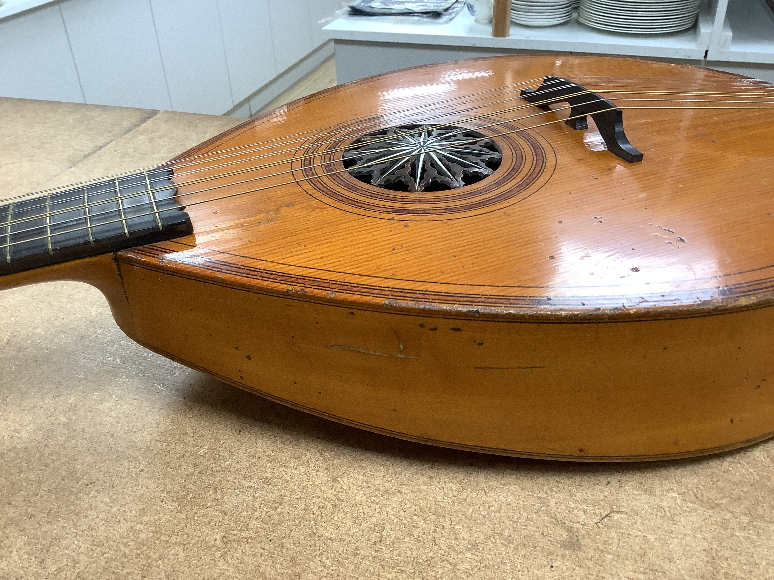 An 18th century English guitar, c.1760-80, possibly of London manufacture by Preston or Hintz, with ten watch key tuned strings, with maple back and neck, spruce soundboard, three original square section holes intended f